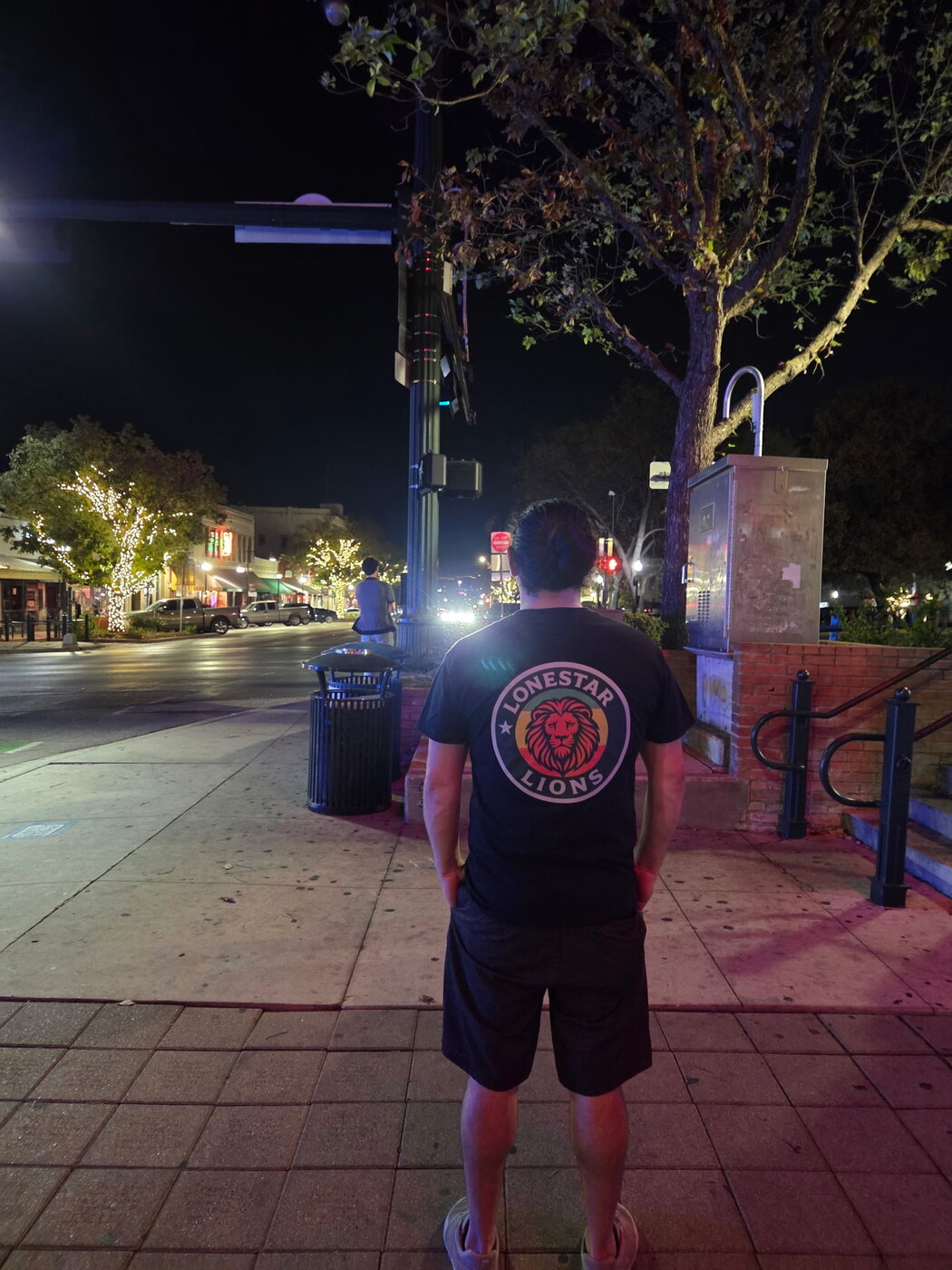 Lonestar Lions shirt worn in downtown San Marcos at night